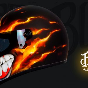 Black motorcycle helmet with realistic orange and red flame design featuring menacing white teeth with blood-red gums